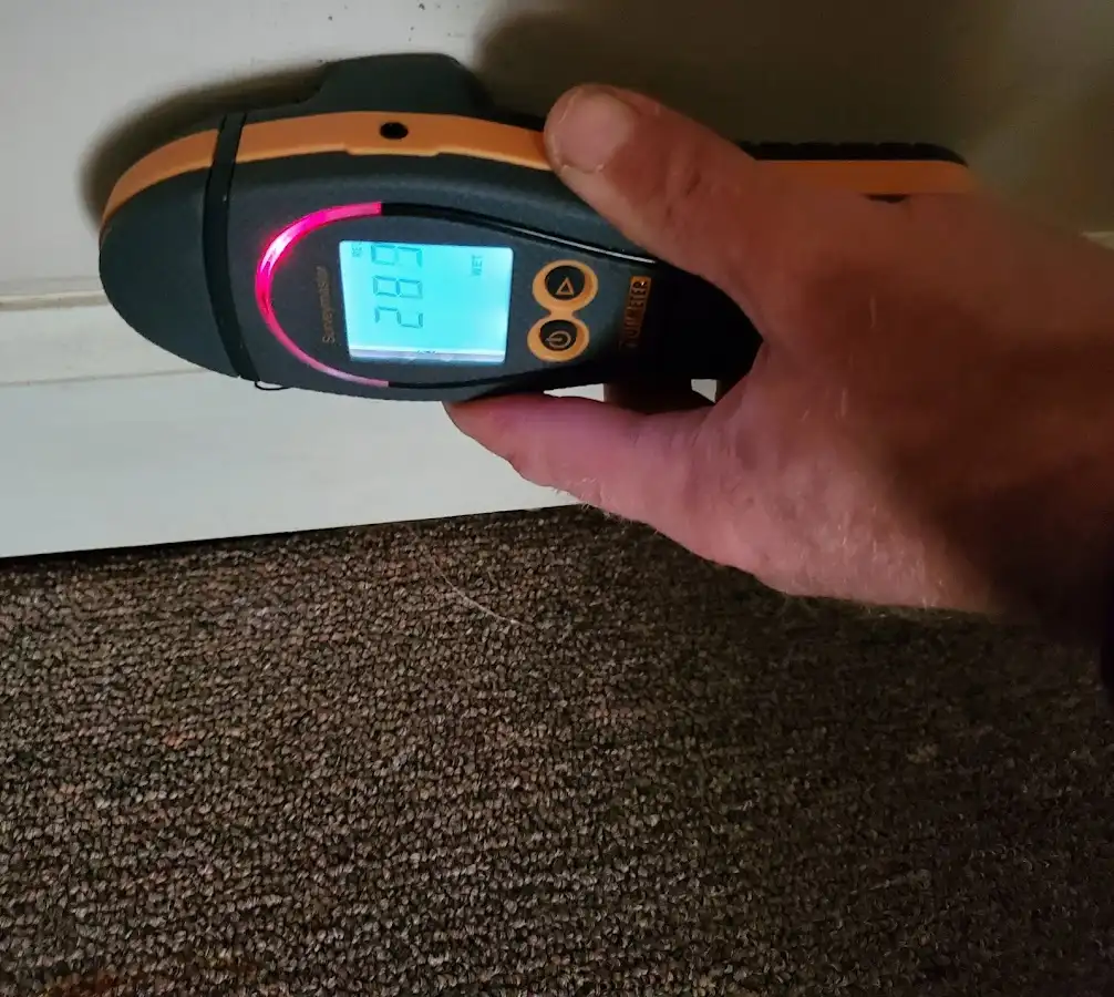 Moisture detection at baseboard during Storm Damage Restoration in Meriden
